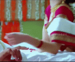 Parvati Melton nude cleavage in red hot low neck blouse gif